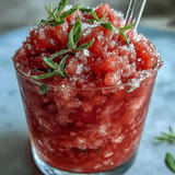Enjoy this sugar-free Frozen Watermelon Lemonade Slushie, perfectly blended for refreshment.