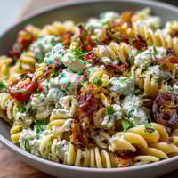 Elote Pasta Salad with Cotija, Chili and Lime in a vibrant, creamy bowl, perfect for summer BBQs and Mexican-inspired gatherings.